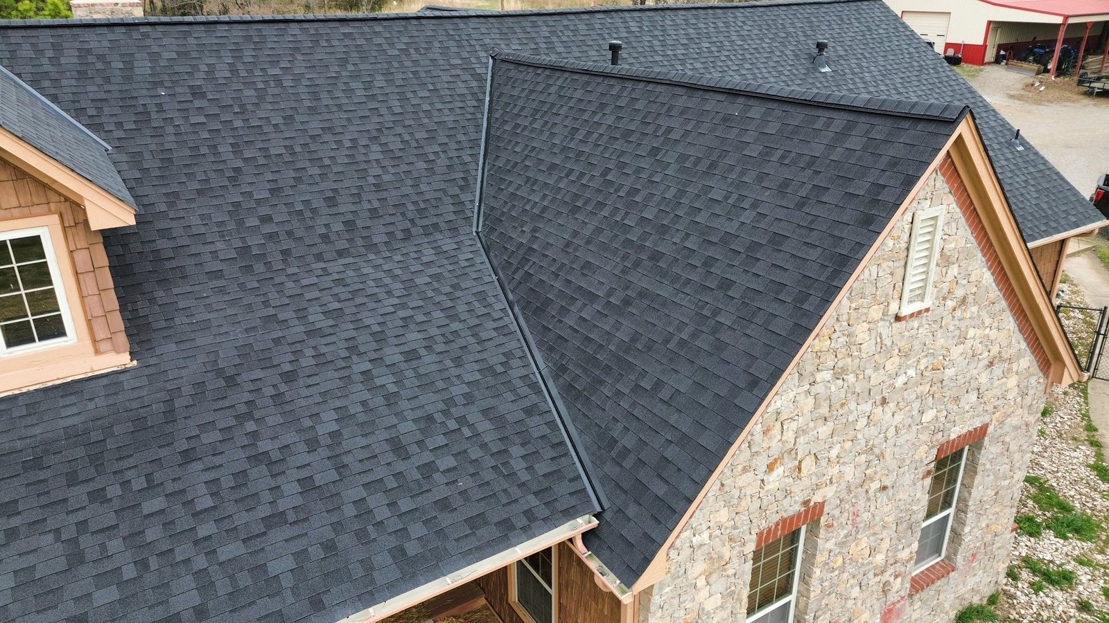 Owens Corning Duration Storm Class 4 Impact Resistant shingles with black valley metal and hip ridge cap installed by Aces Roofing and Exterior Solutions, South 4160 Road, Claremore, OK