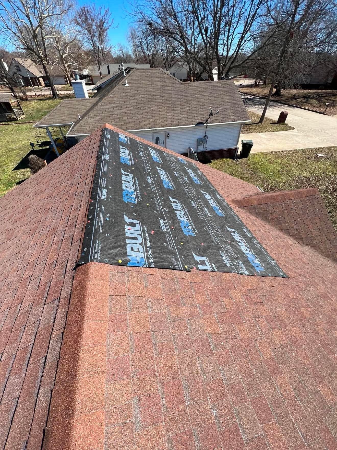 Emergency roof tarping service protecting storm-damaged roof in Oklahoma