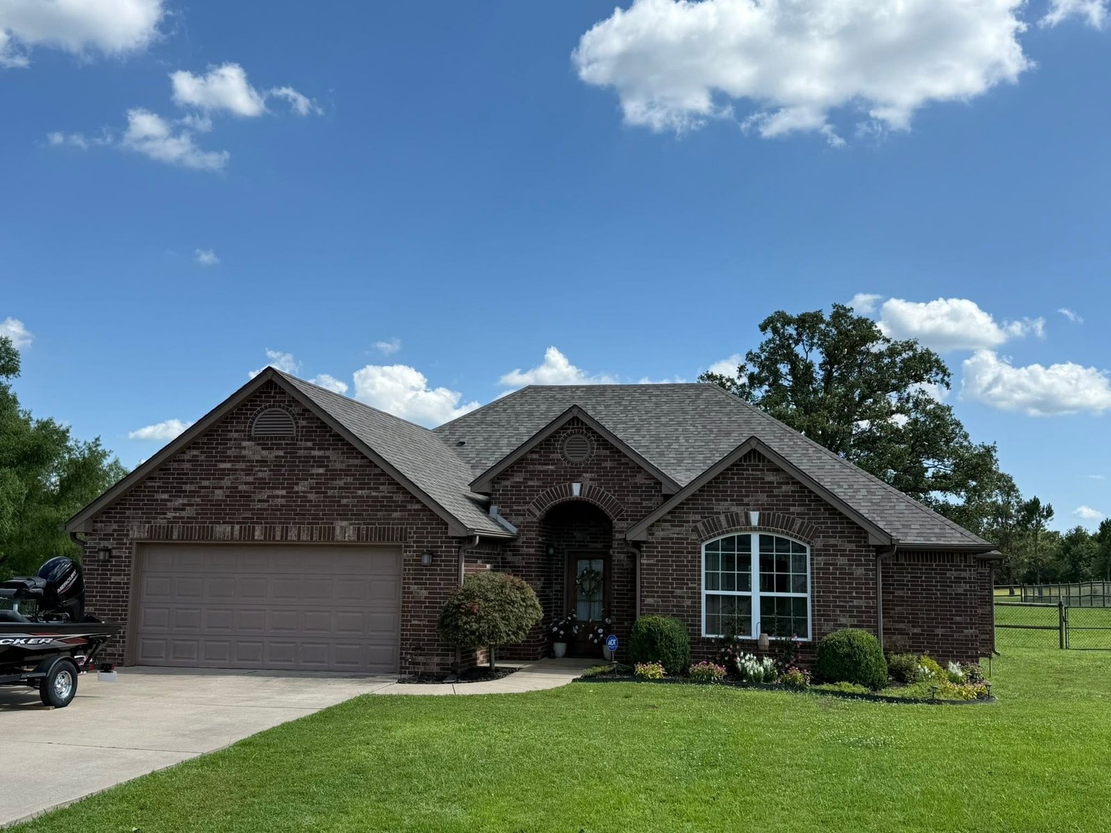 Brick home in Claremore, OK with new Class 3 Impact Resistant Owens Corning Duration roof, front elevation